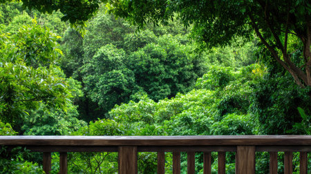 Experience the serene beauty of a vibrant forest view from a wooden deck. This lush greenery scene invites relaxation and peace amidst nature's calm ambiance.の素材