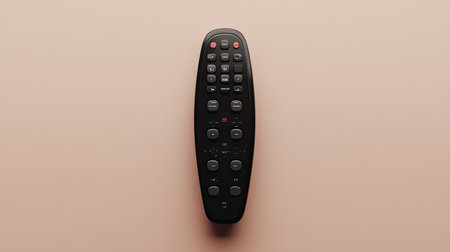 This image features a sleek black remote control on a minimalist background, emphasizing its design and functionality for modern technology and everyday use.の素材