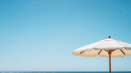 Close-up of a beach umbrella with a clear blue summer sky, leaving space for copyの素材