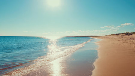 A sandy beach with calm waters under a bright summer sun, leaving space for textの素材