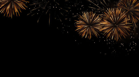 Brilliant fireworks lighting the sky over a dark backdrop, leaving the lower section for copy space.の素材