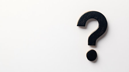 Top view of a large, bold question mark on a white background, with plenty of space for text around it.の素材