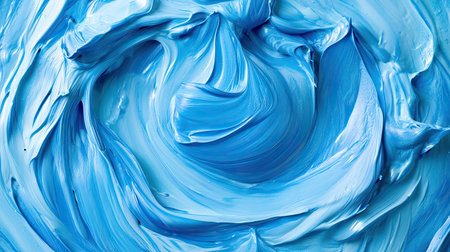 A close-up, top view of a swirling blue paint pool, with textures and shades of blue creating a calming effectの素材