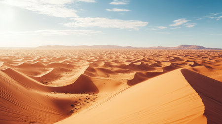Aerial view of vast orange sand dunes in the Sahara Desert, Merzouga. High resolution, clean background, ample copy spaceの素材