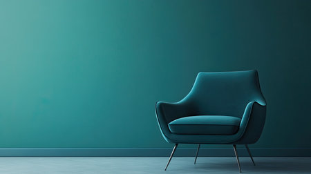 A stylish modern teal chair positioned against a smooth wall, offering a contemporary touch to minimalist interior settings, perfect for home decor inspiration.の素材