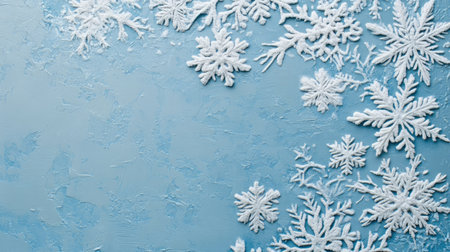 Beautiful arrangement of winter snowflakes on a soft blue background. Ideal for winter-themed projects, seasonal greetings, and decorative designs showcasing nature's beauty.の素材