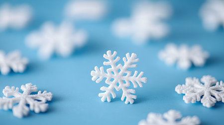 A bright white snowflake stands out against a soft blue background, showcasing intricate details and a refreshing winter feel. Perfect for seasonal themes.の素材