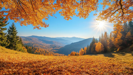 Golden autumn leaves blanketing mountain slopes with a clear blue sky aboveの素材