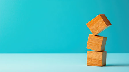 A toppled stack of wooden blocks, showcasing failure and setbacks, against a minimalistic background with copy spaceの素材