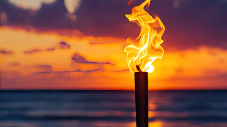 A captivating image of a flaming torch against a stunning sunset over the ocean, evoking feelings of warmth, tranquility, and scenic beauty. Ideal for travel and vacation themes.の素材