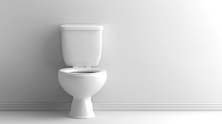 A sleek modern white toilet positioned against a simple bright wall. Ideal for bathroom design projects, showcasing minimalism and cleanliness in sanitary spaces.の素材