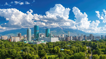 A breathtaking view of a modern city skyline surrounded by picturesque mountains and vibrant green trees, showcasing the harmony between urban life and nature.の素材