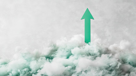 An artistic representation of a green arrow rising through soft, abstract clouds against a gentle gray background, symbolizing growth and positivity.の素材