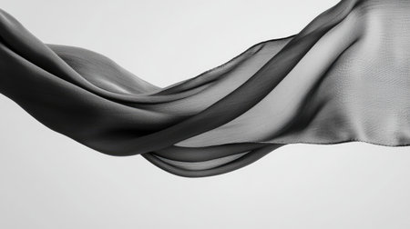 Captivating image of elegant fabric gracefully flowing in soft shades, creating a serene and minimalist aesthetic with light and shadow interplay.の素材