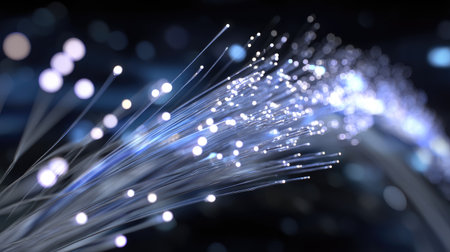 A mesmerizing abstract image showcasing fiber optic lights with bright, glowing dots set against a dark backdrop. This visual captures the essence of modern technology and innovation.の素材