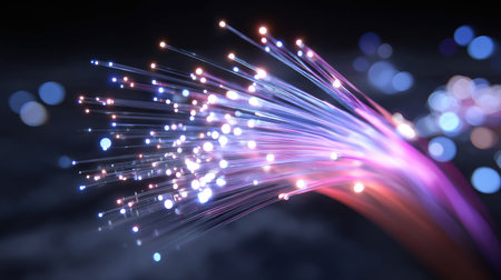 Captivating abstract depiction of glowing fiber optic light trails with sparkling particles, set against a dark background. Ideal for technology themes.の素材