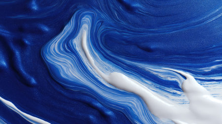 This abstract image showcases a stunning combination of swirling blue and white paint textures. The dynamic movement and smooth transitions create an artistic and modern appeal, perfect for various creative projects.の素材