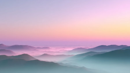 A breathtaking view of a serene landscape at sunrise, showcasing misty mountains bathed in soft pink and purple hues, perfect for nature enthusiasts.の素材