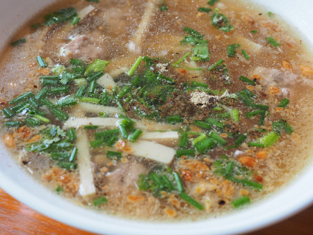 Put the rice noodles in a large bowl, and cover them with very hot tap waterの写真素材