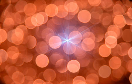 Decorations on the Christmas lights and the general pattern in sparkling blurred backgroundの写真素材