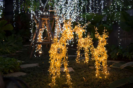 Decorations on the Christmas lights and the general pattern in sparkling blurred backgroundの写真素材