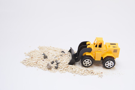 Yellow loader toy isolated on white backgroundの写真素材