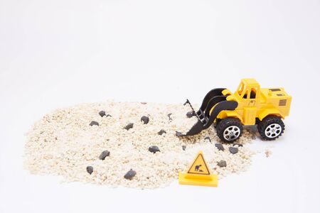 One car yellow toy isolated on white backgroundの写真素材