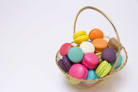 Set of macarons isolated on white wooden tableの写真素材