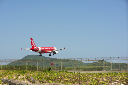 Phuket - February 16, 2016: The plane was landing near Mai Khao Beach on Phuket Island in the Andaman Sea in Thailand.のeditorial素材