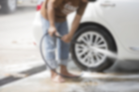 Focus blur the car wash with the injection of pressurized water to wash the carの写真素材