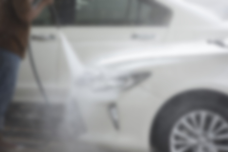 Focus blur the car wash with the injection of pressurized water to wash the carの写真素材