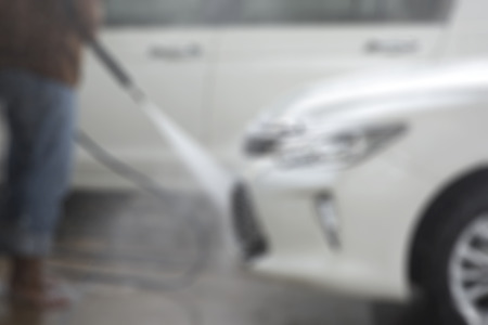 Focus blur the car wash with the injection of pressurized water to wash the carの写真素材