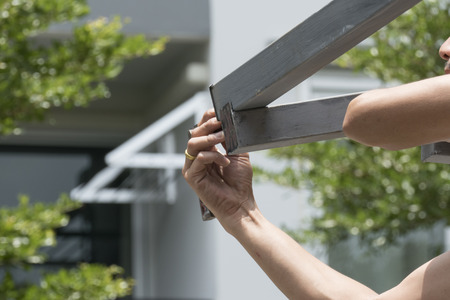 Install roof construction with stacks of roof tiles for building houses.の写真素材
