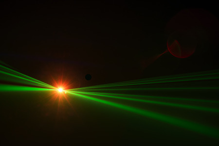 The led spot light covering light beams on an empty stageの写真素材