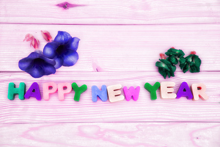 Happy New Year text in vintage letterpress wood type blocksの写真素材