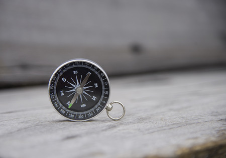 Watch a map and compass to blur the background scenery vintage.