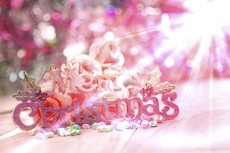 Christmas letter with flowers glittering background Gradient background.の写真素材