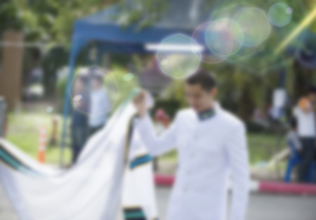 Graduation dress was photographed together with relatives at the universityの写真素材