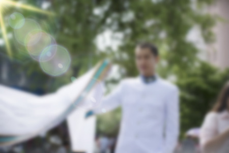 Graduation dress was photographed together with relatives at the universityの写真素材