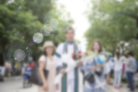 Graduation dress was photographed together with relatives at the universityの写真素材