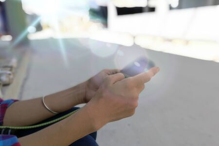Woman play smart phone in the Gradient background