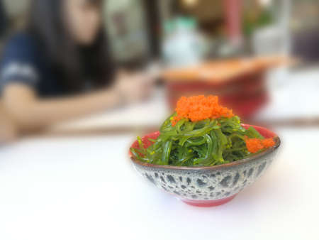 A portion of fresh seaweed on a white backgroundの写真素材