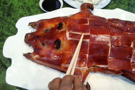 Barbecued suckling pig cut to plant at Chinese restaurant Food Thaiの写真素材