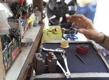 Watch repair craftsman repairing watchの写真素材