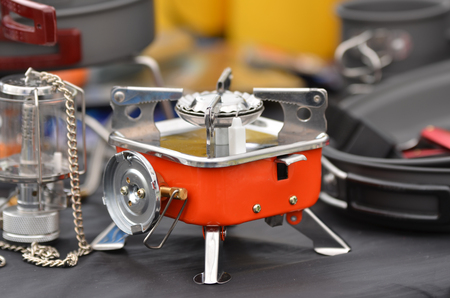 Camping equipment a campground with a small kettle and a camping gas stationの写真素材