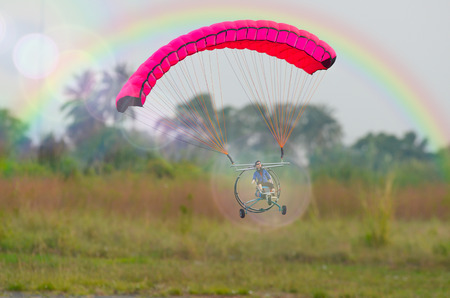 Travel with umbrellas fly the Paramotor, and love the atmosphere that surroundsの写真素材