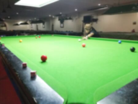 Blurred snooker players put cue ball for shootingの写真素材