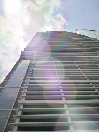 Bottom view of modern skyscrapers in the business district with beautiful light and shineの写真素材