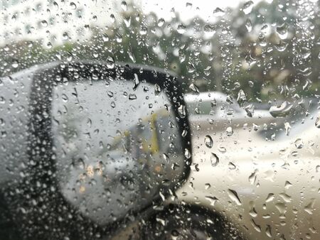 rain drops on the wing mirror,The concept of safety while drivingの写真素材