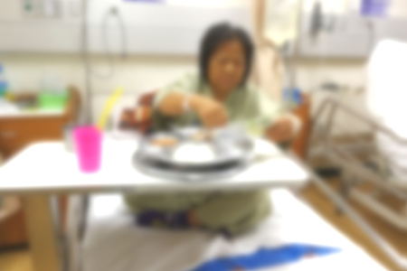Blurred images of patients and the work of nurses in the ICU room.の写真素材